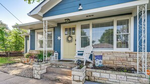 A house with a porch, a front door, and a mailbox. - 1 Mi to Dtwn: Family-friendly Brenham Bungalow! (Brenham)