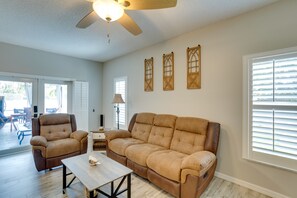 TV, fireplace, books - Renovated Sunny Port St Lucie Home w/ Outdoor Pool (Port Saint Lucie)