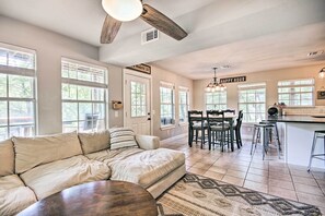 Relax in this spacious living area with a large sofa and dining space.