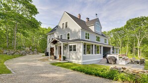 A two-story house with a covered porch, a stone pathway, and a well-maintained lawn. - Spacious Kennebunkport Home w/ View, 2 Mi to Beach (Kennebunkport)