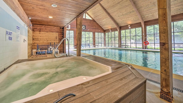 A wooden interior with a hot tub and a pool. - Alpine Getaway w/ Grill: Walk to Lake! (Cashiers)