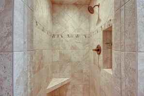 A shower with a handheld showerhead and a wall-mounted faucet. - Red Lodge Mountain Home < 7 Miles to Ski Slopes! (Red Lodge)