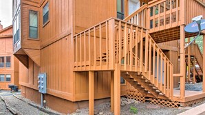 A wooden building with a staircase leading to a balcony. - 2 Blocks to Skiing & Mtb: Angel Fire Condo (Angel Fire)