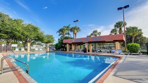 A swimming pool with lounge chairs and a covered area labeled "Vista del Lago". - Steps to Pool: Winter Garden House w/ Lanai! (Winter Garden)