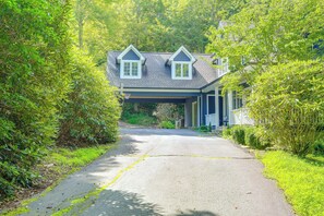 A two-story house with a covered driveway leading to the entrance. - Boone Home w/ Fire Pit - Near App Ski & Sugar Mtn! (Boone)