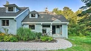 A two-story house with a brick driveway, a covered front porch, and a well-maintained garden. - Family-friendly Stratton Gem Close to Slopes! (Stratton)