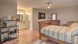 A bedroom with a bed, a nightstand, a dresser, a mirror, and a shelf with kitchen items. - ~ 10 Mi to Downtown: Quiet Dallas Studio (Dallas)