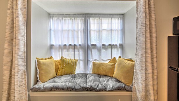 A window seat with cushions and curtains. - ~ 10 Mi to Downtown: Quiet Dallas Studio (Dallas)