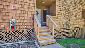 A wooden building with a front door, a set of wooden stairs leading up to the entrance, and a small porch area. - Pet-friendly Bryan Escape ~ 2 Mi to Texas A & M (Bryan)