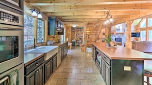 A log cabin interior with a kitchen, dining area, and living room. - Grand 4,000 Sq Ft House - 11 Miles to Lancaster! (New Providence)