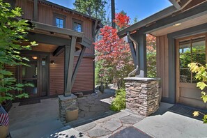 A two-story wooden house with a stone pathway leading to the entrance. - Modern Alpine Home on Prospector Golf Course! (Cle Elum)