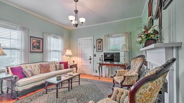A living room with a sofa, armchairs, a coffee table, a fireplace, and a television. - Historic Sparta Home Near Waterfalls & Hikes! (Sparta)