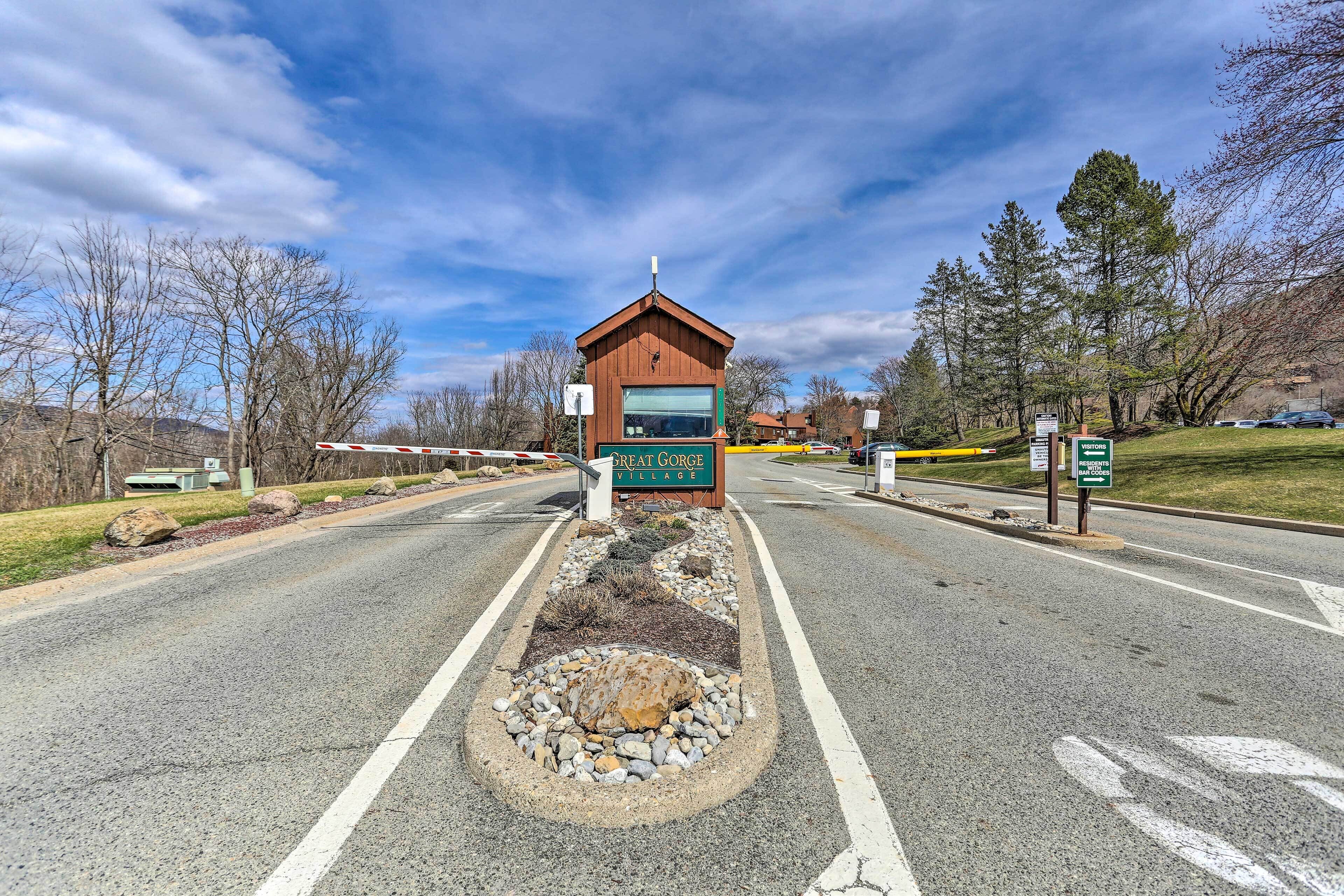 A road leading to a building with a sign reading "Great Gorge Village."