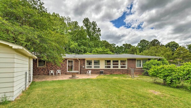 A single-story house with a brick exterior and a small front yard. - Cozy Charlotte Retreat w/ Yard ~ 5 Mi to Dtwn (Charlotte)