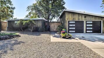 Enjoy a residence with a two-car garage, well-manicured garden, and a blend of rustic and contemporary style.
