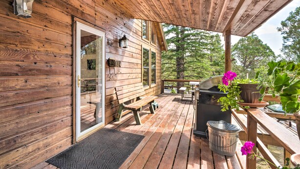 A wooden deck with a bench, a grill, and potted plants. - Alto Home w/ Deck & Views ~ 15 Mi to Ski Apache! (Alto)