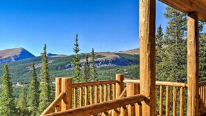 A wooden deck with a railing overlooking a mountainous landscape. - Fairplay Cabin w/ Wraparound Deck & Mountain Views (Fairplay)