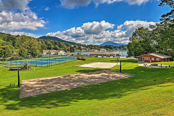 A sports complex with a tennis court, a baseball field, and a baseball diamond.