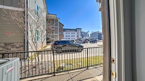 A view from a window overlooking a street with parked cars and buildings. - Modern Retreat ~ 1/2 Mi to Bryant-denny Stadium (Tuscaloosa)