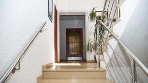 A staircase with metal railings, a wooden door, and a potted plant. - APP4 Romantic villa with pool - 5 min from the beach! (Novigrad)