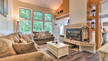 Apartment (3 Bedrooms) | Living area | Fireplace, video game console