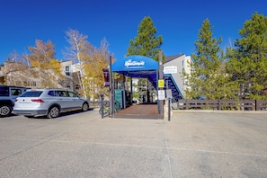 A parking area with a covered entrance to a building labeled 'The Mountainside.' - Ski, Soak & Explore! Granby Getaway w/ Mtn Views (Granby)