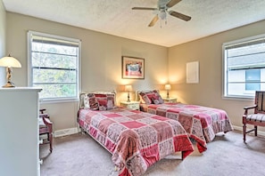 A bedroom with two beds, a ceiling fan, and a window with blinds. - Park Once, Walk to Every Ole Miss Tradition (Oxford)
