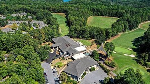 An aerial view of a residential area with houses, a golf course, and a lake in the background. - Views, Pools & Marina: Lake Keowee Condo! (Salem)
