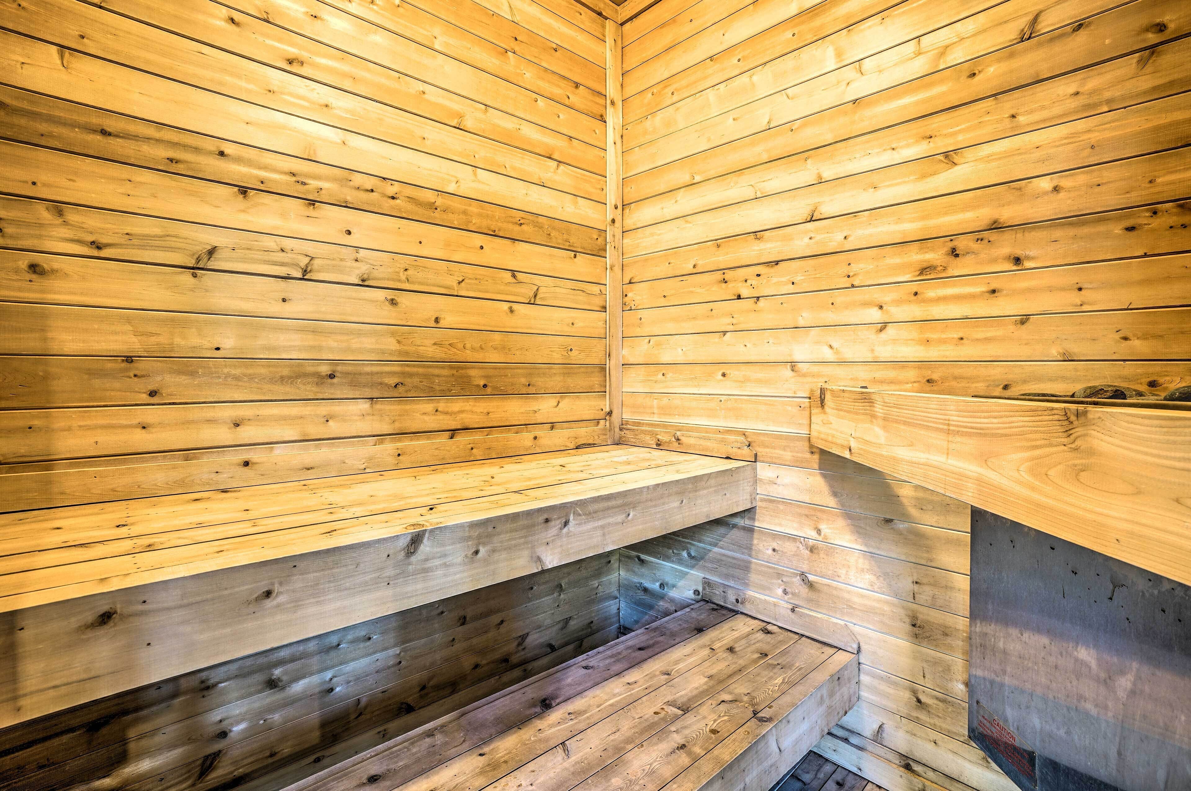 A sauna with wooden walls and benches.