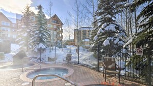 A pool area with a brick border, metal railings, and a no swimming sign. - Walk to Lifts: Breck Condo on Main St w/ Amenities (Breckenridge)
