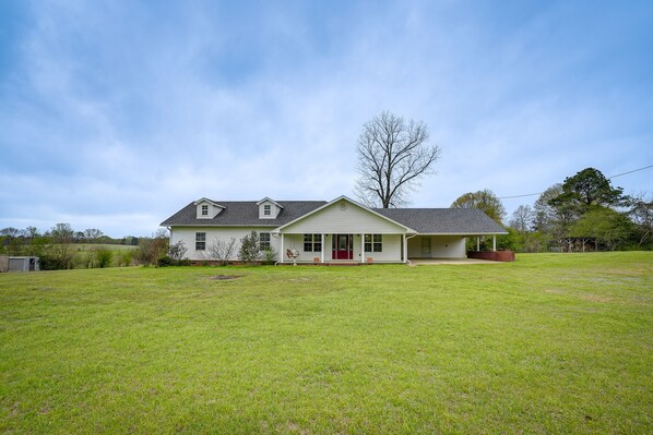 Stroll up to the charming front porch of this cozy home.