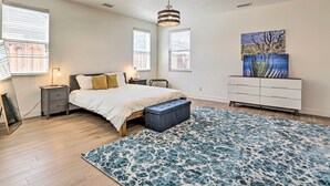 A bedroom with a bed, bedside tables, a dresser, a rug, and artwork on the wall. - 12 Mi to Riverwalk District: Quiet Reno Retreat (Reno)