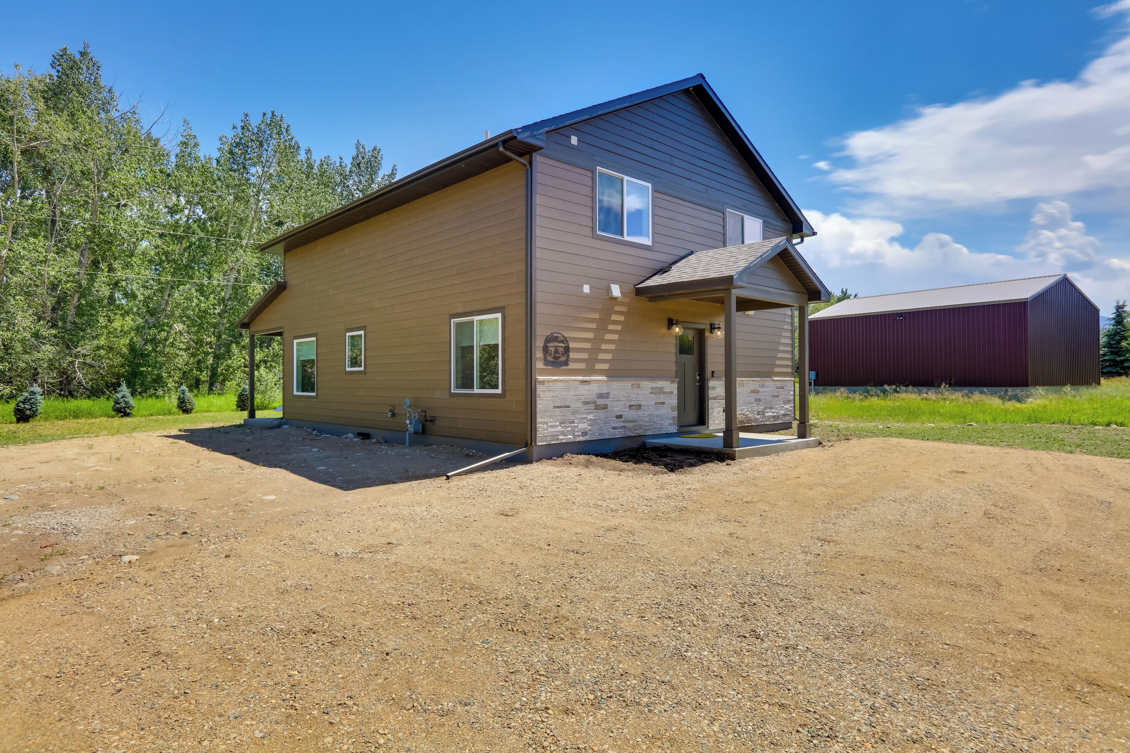 A two-story house with a front porch and a garage.
