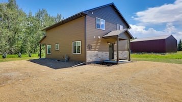 A two-story house with a front porch and a garage.