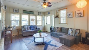 A living room with two sofas, a coffee table, and a ceiling fan. - Steps to Beach & Bites: Catalina Island Retreat! (Avalon)