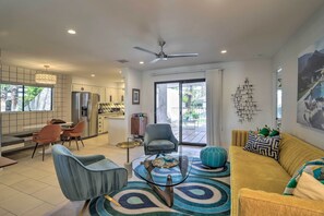 A modern living room with a sofa, chairs, a coffee table, and a dining area with a table and chairs. - Chic Palm Springs Gem w/ Patio + Pool Access! (Palm Springs)