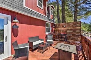 A covered outdoor patio with wicker furniture, a fire pit, and a barbecue grill. - Mountain Homestead: Swim, Hike, & Camp On-site! (Los Gatos)