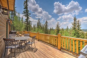 A wooden deck with outdoor furniture, a railing, and a view of trees and mountains. - Jefferson Cabin w/ Fire Pit & Sauna Near Hiking! (Jefferson)