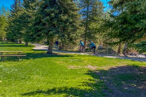 A park with a picnic table and a paved path. - Walk to Frisco Main St: Townhome Steps to Trail! (Frisco)