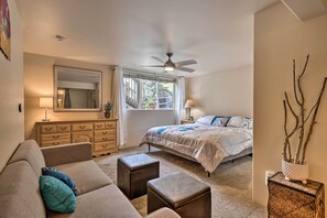 A bedroom with a bed, a ceiling fan, a dresser, a mirror, and a window. - Walk to Frisco Main St: Townhome Steps to Trail! (Frisco)