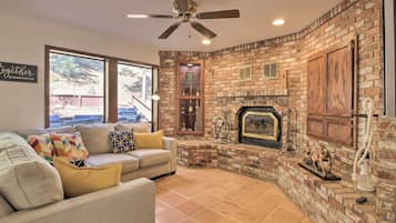 TV, fireplace, books