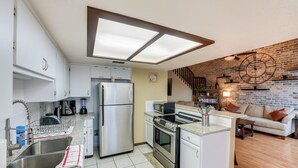 A modern kitchen with stainless steel appliances, a built-in oven, and a central island. - Boat Slip Access: North Padre Island Condo! (Corpus Christi)