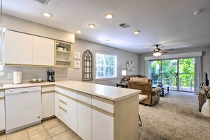 Enjoy a spacious kitchen and living area with a dishwasher and comfortable seating.