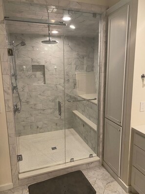 Shower, hair dryer, towels, toilet paper