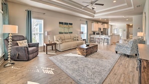 A spacious living room with a sofa, armchairs, a coffee table, and a ceiling fan. - Walk to Shore: 'oyster House' Port St Joe Getaway (Port St. Joe)