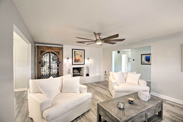 TV, fireplace, books - Bright + Airy Canalfront Getaway w/ Heated Pool! (North Fort Myers)