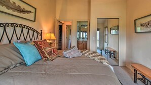A bedroom with a bed, pillows, a bedside table, a lamp, a mirror, and a bench. - 'high Gravity' Banner Elk Custom Chalet w/ Views! (Banner Elk)