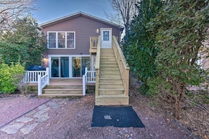 A two-story house with a wooden staircase leading to a front door. - Central Hummelstown Apt: 4 Miles to Hershey Park! (Hummelstown)