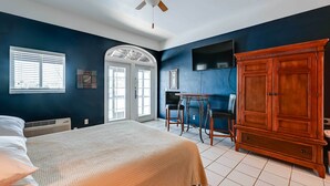 A bedroom with a bed, a wardrobe, a desk, and a chair. - Studio w/ Marina Views: 15 Mi To Everglades! (Naples)