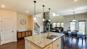 A spacious kitchen with granite countertops, a built-in sink, and pendant lighting. - Nolensville Home w/ Free Wifi: 20 Mi to Nashville! (Nolensville)